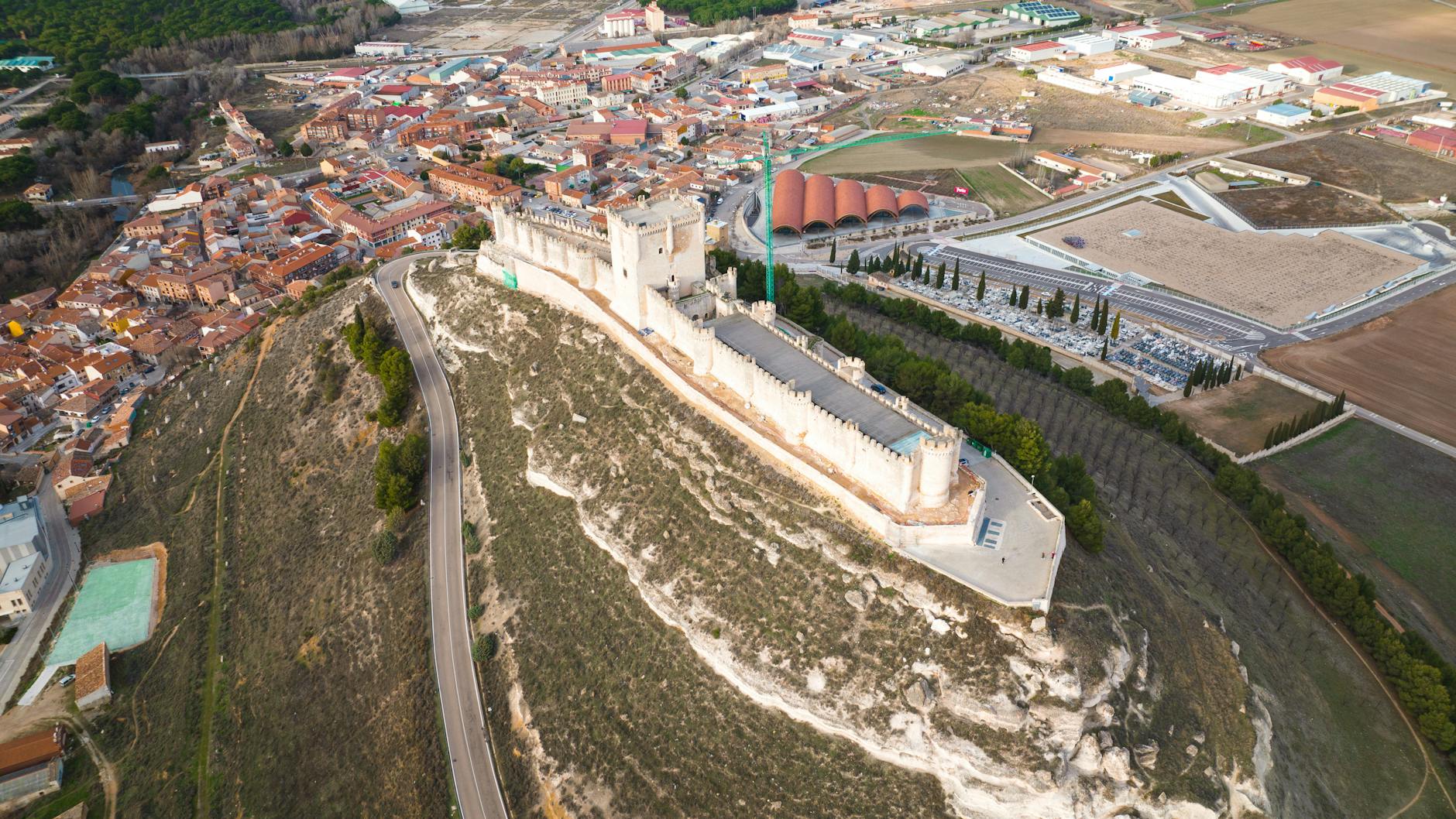 Stunning aerial view of the historic Castillo de Peñafiel located in Castilla y León, Spain.